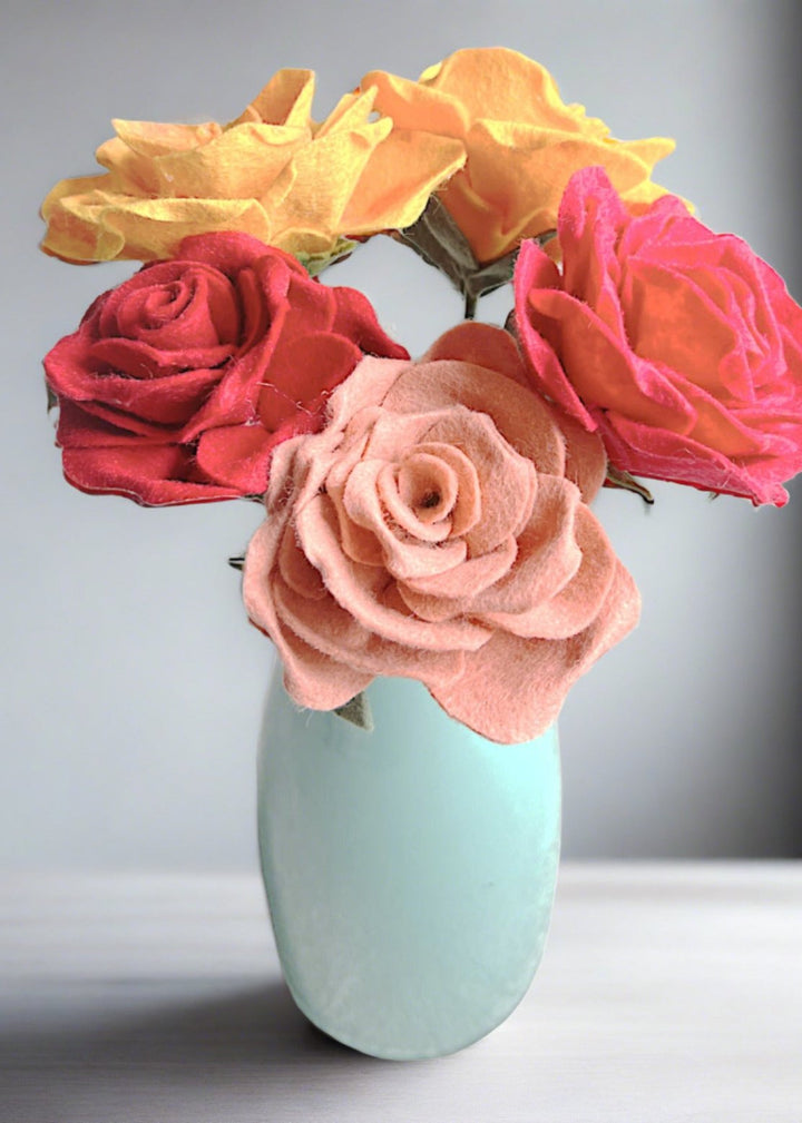 a vase filled with flowers sitting on top of a table